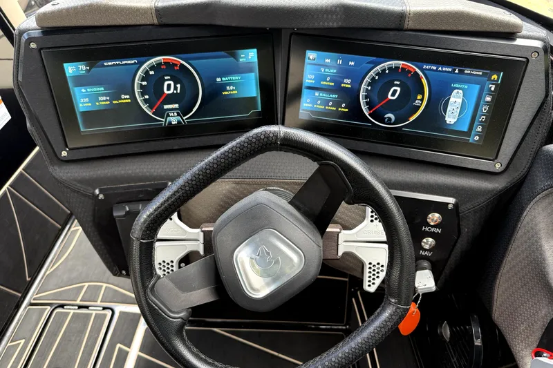 Slide: The Image of 2023 Centurion Fi25 dashboard with dual digital displays and steering wheel. - 10