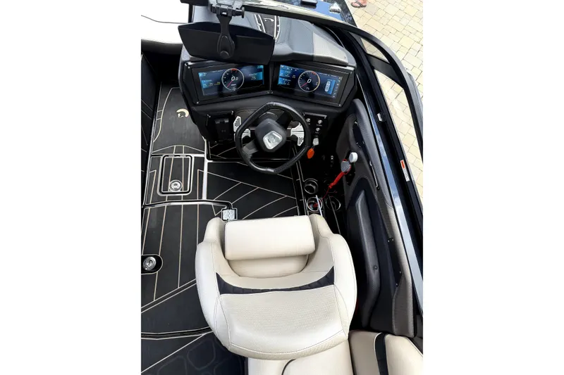 Slide: The Image of 2023 Centurion Fi25 boat cockpit with modern dashboard and steering wheel. - 8