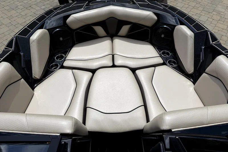 Slide: The Image of Luxurious seating in 2023 Centurion Fi25 boat, featuring sleek design and cup holders. - 9