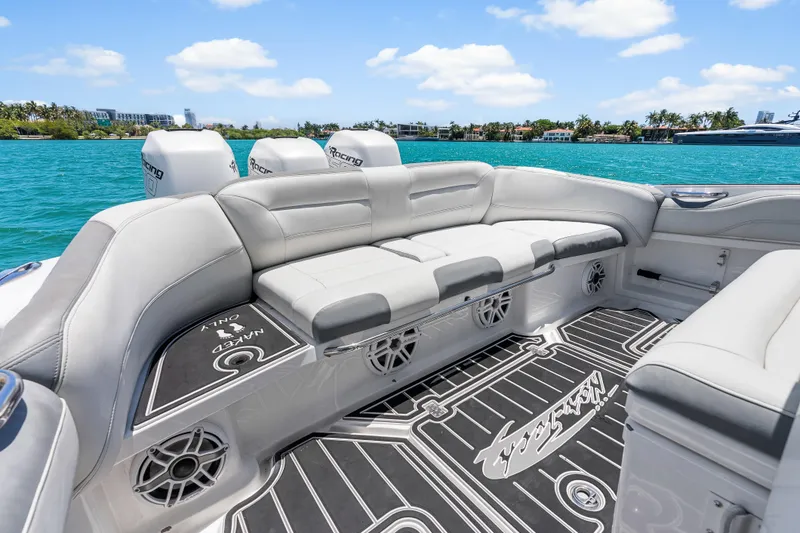 Slide: The Image of 2019 Nor-Tech 390 Sport Center Console with luxurious seating and scenic ocean view. - 13