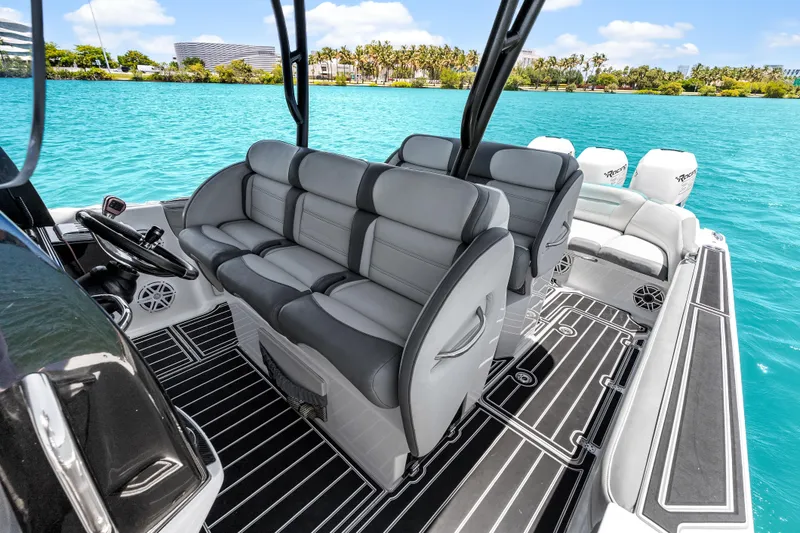 Slide: The Image of 2019 Nor-Tech 390 Sport Center Console boat interior with luxurious seating and sleek design. - 17