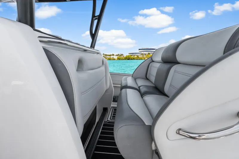 Slide: The Image of 2019 Nor-Tech 390 Sport Center Console interior with luxurious seating and ocean view. - 20