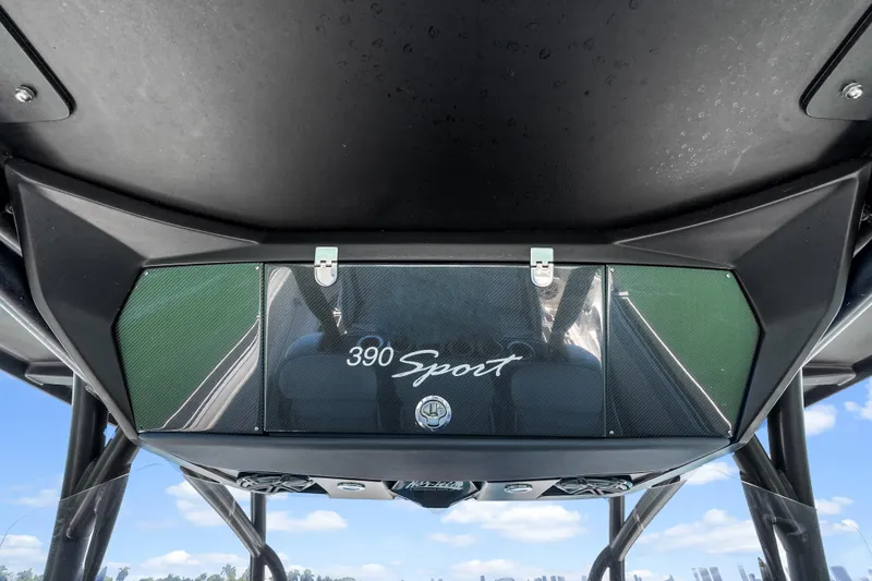 Slide: The Image of 2019 Nor-Tech 390 Sport Center Console boat, featuring sleek design and modern console. - 23