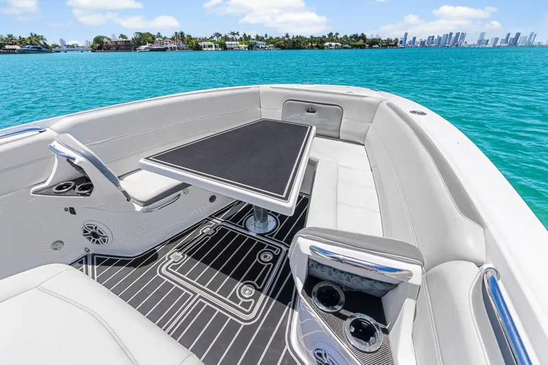 Slide: The Image of Luxurious 2019 Nor-Tech 390 Sport Center Console boat interior with sleek seating and table. - 25