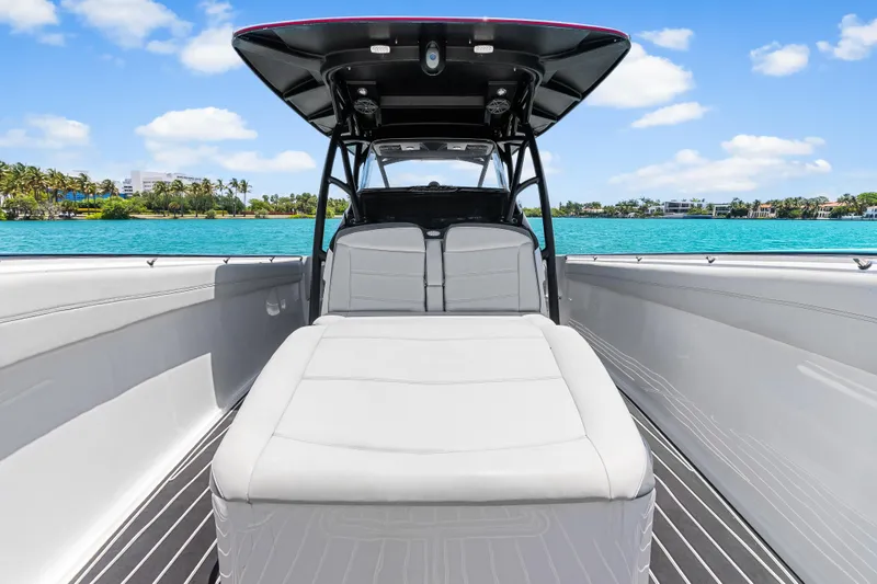 Slide: The Image of 2019 Nor-Tech 390 Sport Center Console boat on clear blue water, sunny day. - 29