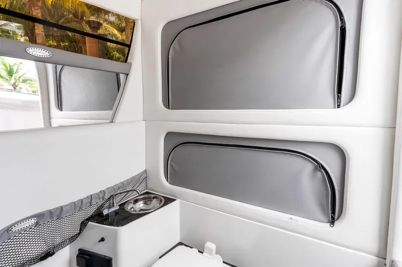 Slide: The Image of Interior cabin of 2019 Nor-Tech 390 Sport Center Console boat, featuring sleek design elements. - 32