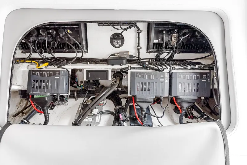 Slide: The Image of Engine compartment of 2019 Nor-Tech 390 Sport Center Console with wiring and components. - 34