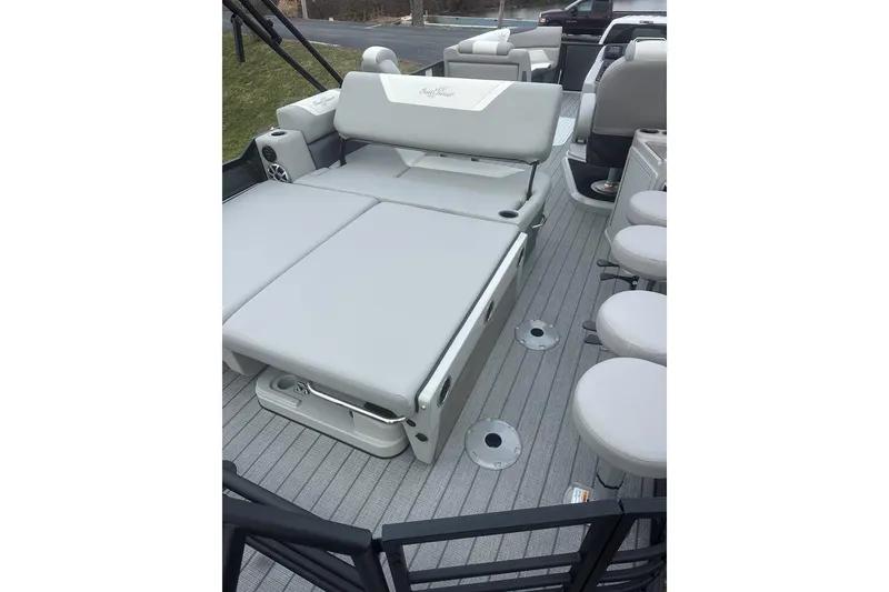 Slide: The Image of 2026 SunChaser Eclipse 25 SBX DH BAR pontoon boat interior with plush seating and modern design. - 10