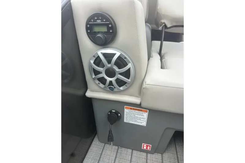 Slide: The Image of Interior of 2026 SunChaser Eclipse 25 SBX DH BAR with speaker and control panel. - 12