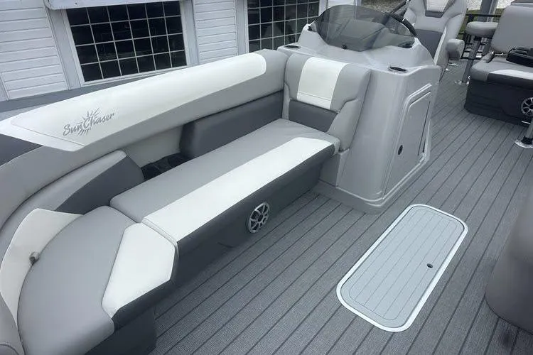 Slide: The Image of 2026 SunChaser Eclipse 25 SBX DH BAR boat interior with gray seating and modern design. - 20