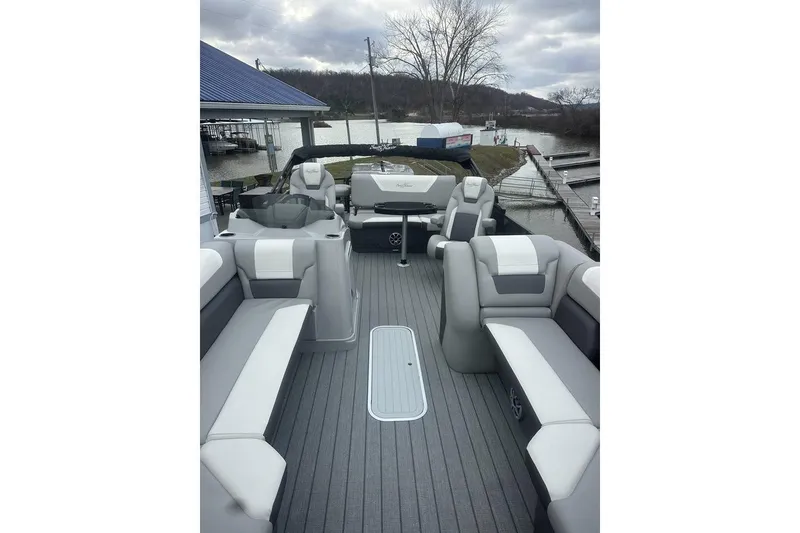 Slide: The Image of 2026 SunChaser Eclipse 25 SBX DH BAR pontoon boat with spacious seating and modern design. - 21