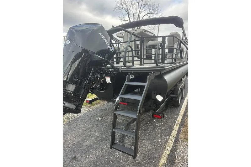 Slide: The Image of 2026 SunChaser Eclipse 25 SBX DH BAR pontoon boat with Mercury outboard motor and boarding ladder. - 3