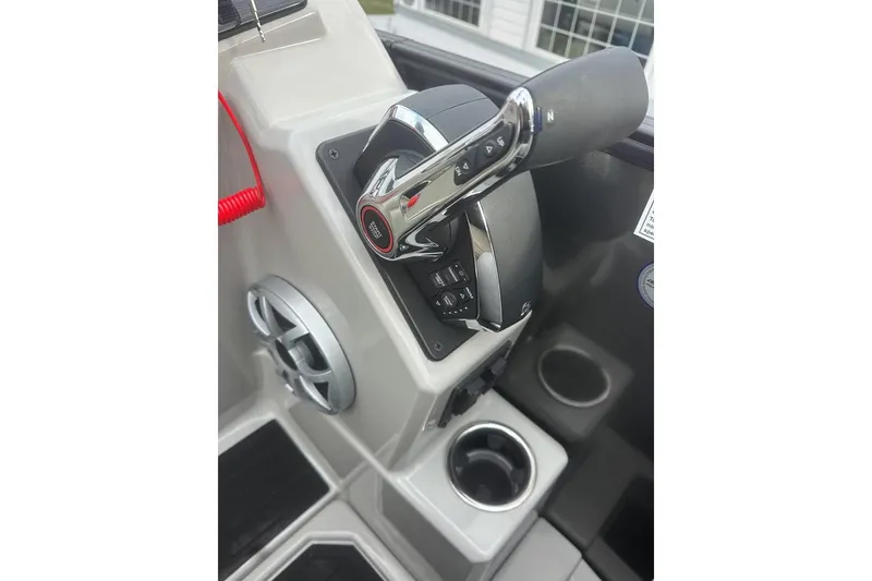Slide: The Image of Throttle control and cup holder on 2026 SunChaser Eclipse 25 SBX DH BAR boat. - 7