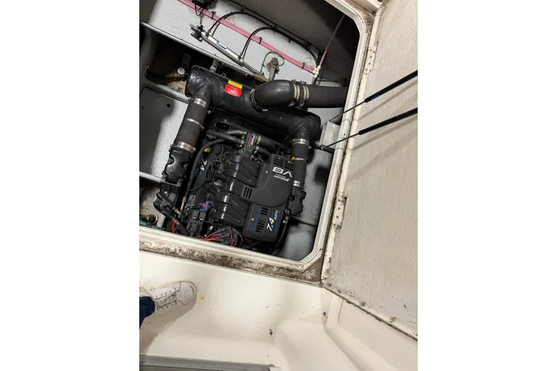 Slide: The Image of Engine compartment of a 2001 Silverton 351 Sedan boat, showcasing detailed mechanical components. - 18