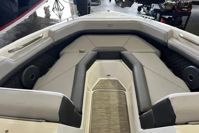 Slide: The Image of 2024 Cobalt R4 boat interior with cushioned seating and modern design. - 10