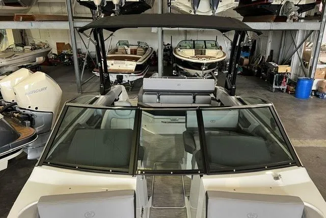 Slide: The Image of 2024 Cobalt R4 boat in showroom, featuring sleek design and spacious seating. - 16