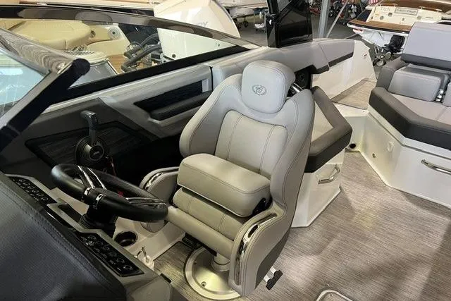 Slide: The Image of 2024 Cobalt R4 boat interior with luxurious captain's seat and modern dashboard controls. - 17