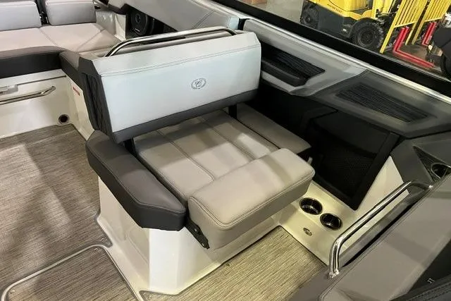 Slide: The Image of 2024 Cobalt R4 boat interior with gray seating and modern design elements. - 18