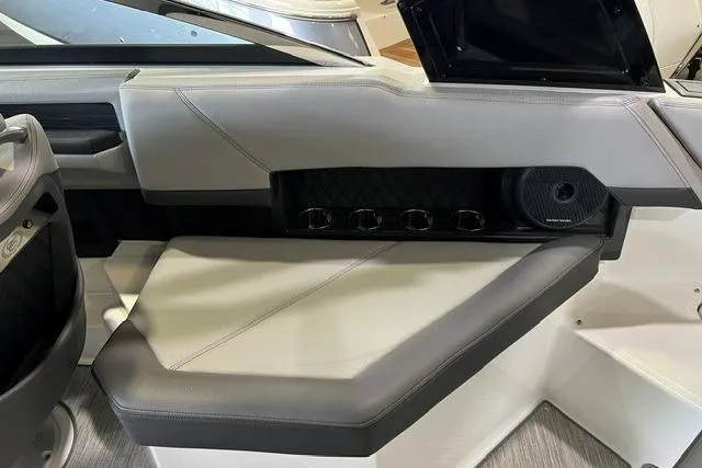 Slide: The Image of 2024 Cobalt R4 boat interior with sleek seating and integrated speaker system. - 21