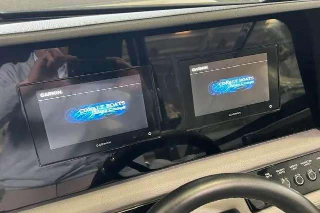 Slide: The Image of Dual Garmin displays on 2024 Cobalt R4 boat dashboard, showcasing Cobalt Boats interface. - 28