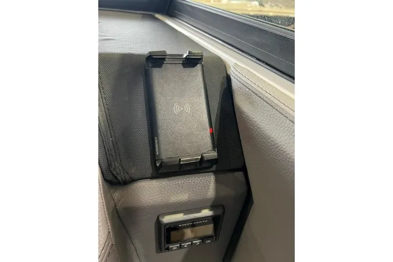 Slide: The Image of Interior of 2024 Cobalt R4 featuring a wireless charging pad and control panel. - 30