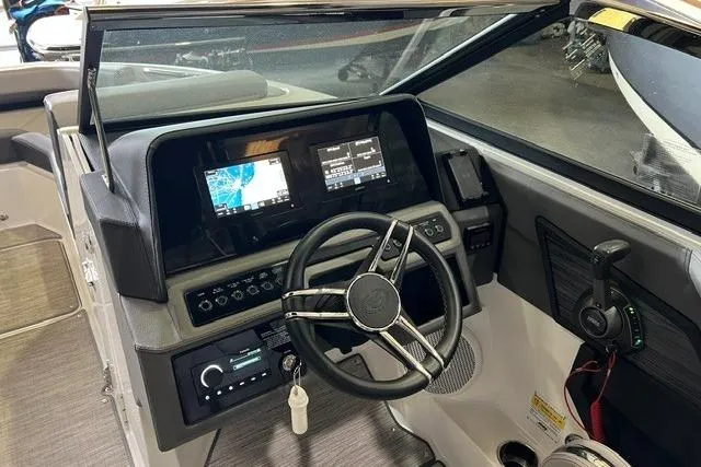 Slide: The Image of 2024 Cobalt R4 boat dashboard with modern controls and navigation screens. - 31
