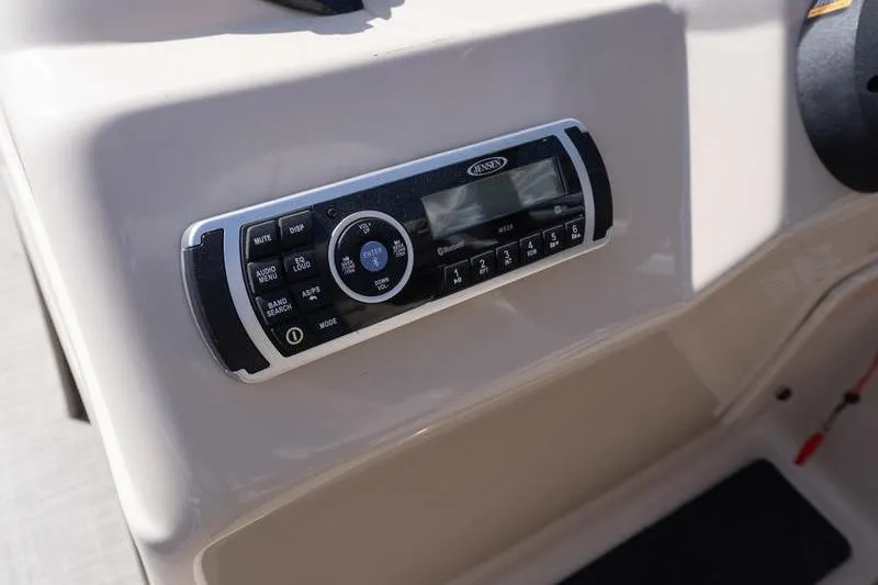 Slide: The Image of 2019 Sun Tracker Fishin' Barge 22 DLX dashboard with Jensen audio system. - 10