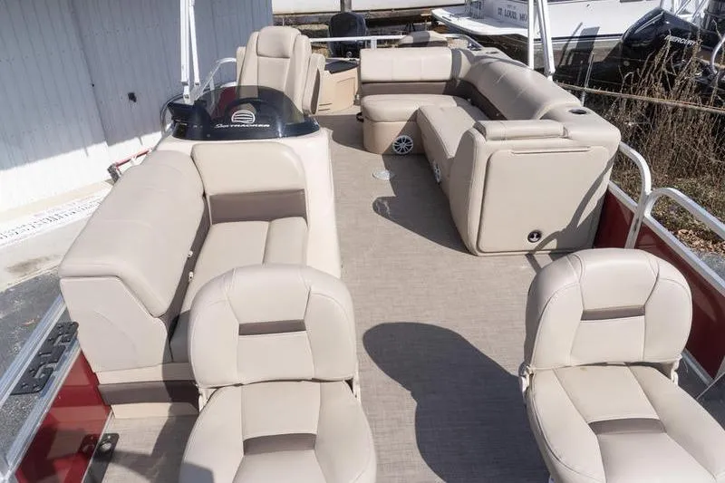 Slide: The Image of 2019 Sun Tracker Fishin' Barge 22 DLX with spacious seating and beige upholstery. - 17