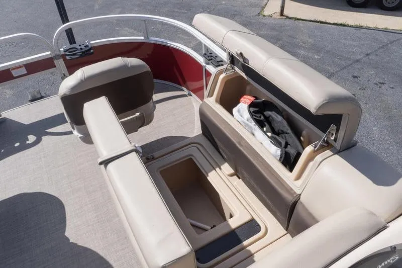 Slide: The Image of 2019 Sun Tracker Fishin' Barge 22 DLX interior with open storage compartments. - 18