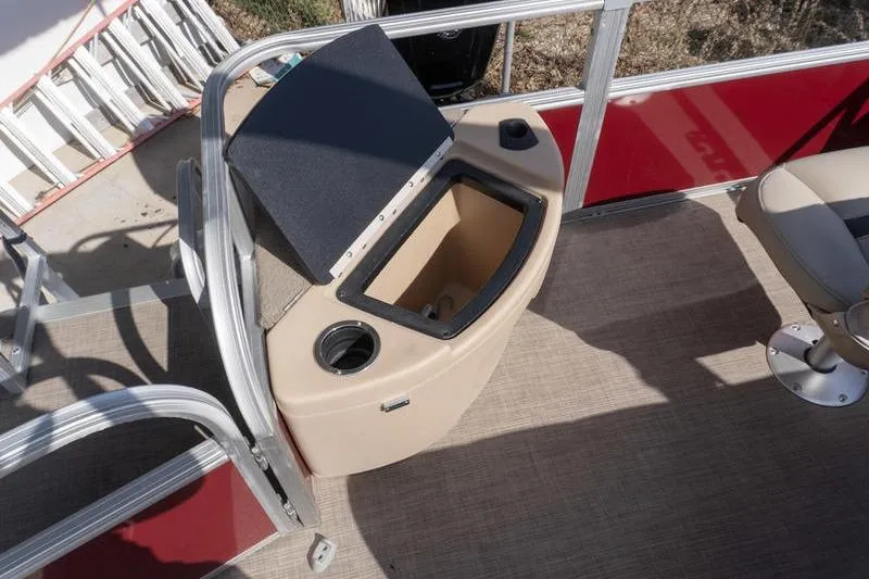 Slide: The Image of 2019 Sun Tracker Fishin' Barge 22 DLX interior with open storage compartment. - 20