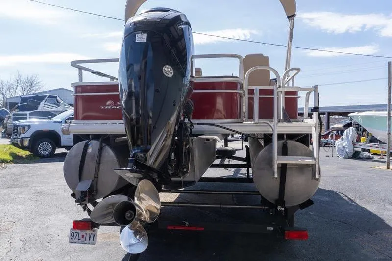 Slide: The Image of 2019 Sun Tracker Fishin' Barge 22 DLX pontoon boat with powerful outboard motor. - 3