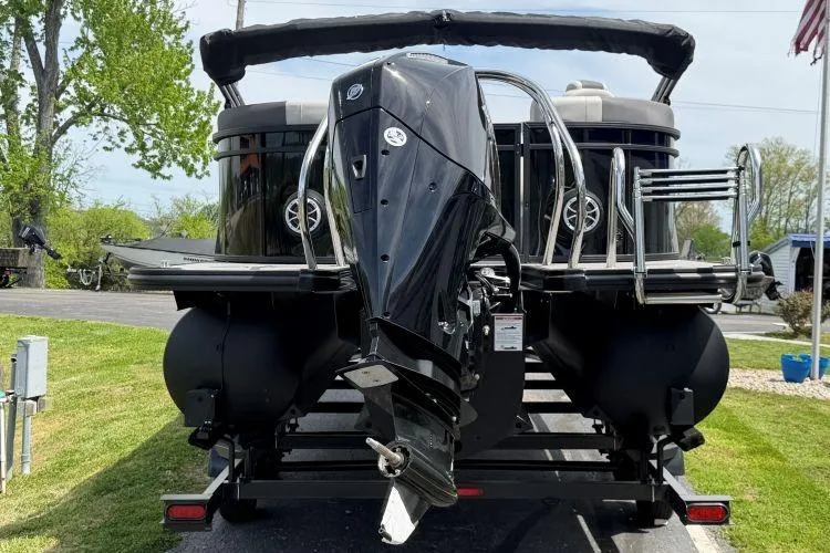 Slide: The Image of 2026 SunChaser Geneva Sport 23 LR DH pontoon boat with powerful outboard motor. - 3
