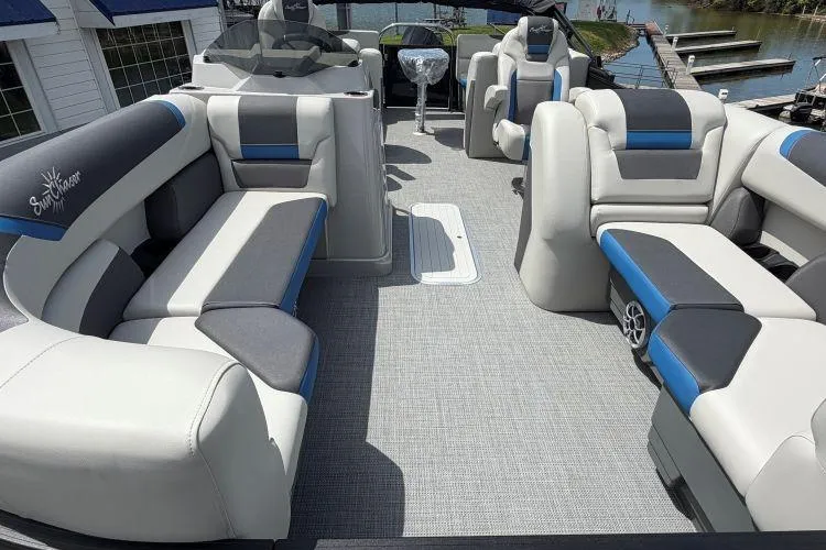 Slide: The Image of Luxurious 2026 SunChaser Geneva Sport 23 LR DH pontoon boat interior with plush seating. - 9