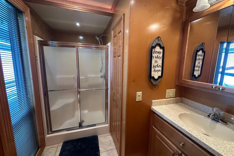 Slide: The Image of Luxurious bathroom in 2007 Fantasy 18x75 houseboat with shower and vanity. - 12