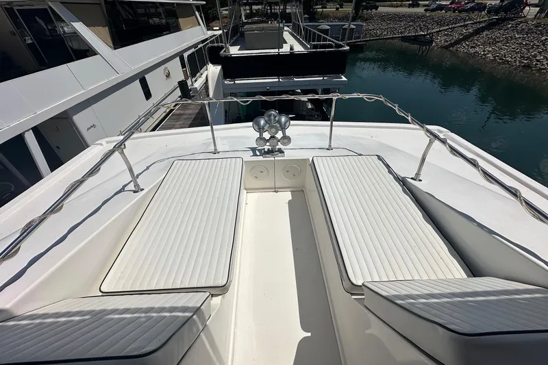 Slide: The Image of Luxury yacht deck with cushioned seating, railing, and water view, Fantasy 18x75 model, 2007. - 14