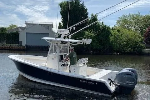 Slide: The Image of 2006 Regulator 24 Classic boat on water with Yamaha outboard motor. - 10