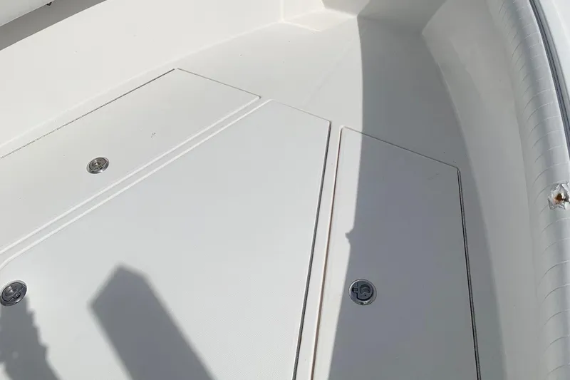 Slide: The Image of 2006 Regulator 24 Classic boat deck with storage compartments. - 14