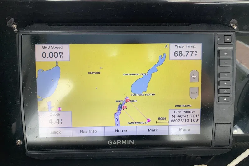 Slide: The Image of Garmin GPS display on 2006 Regulator 24 Classic, showing map, speed, and water temperature. - 17