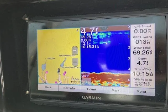 Slide: The Image of Garmin marine GPS display on a 2006 Regulator 24 Classic, showing depth and water temperature. - 2
