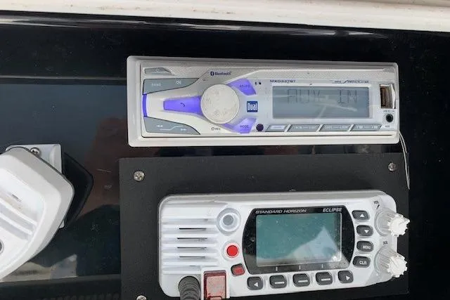 Slide: The Image of Dashboard of a 2006 Regulator 24 Classic boat with radio and communication equipment. - 35