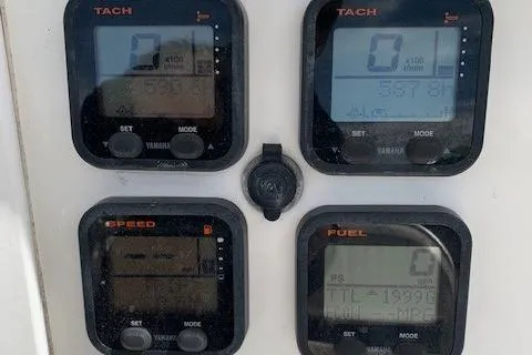 Slide: The Image of Close-up of Yamaha gauges on a 2006 Regulator 24 Classic boat dashboard. - 37