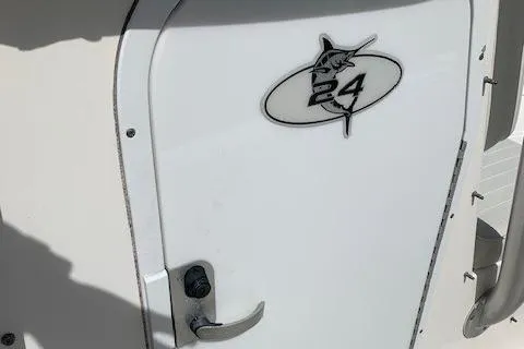 Slide: The Image of 2006 Regulator 24 Classic boat door with logo and handle. - 39