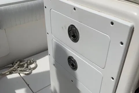 Slide: The Image of 2006 Regulator 24 Classic boat storage compartments with rope detail. - 42