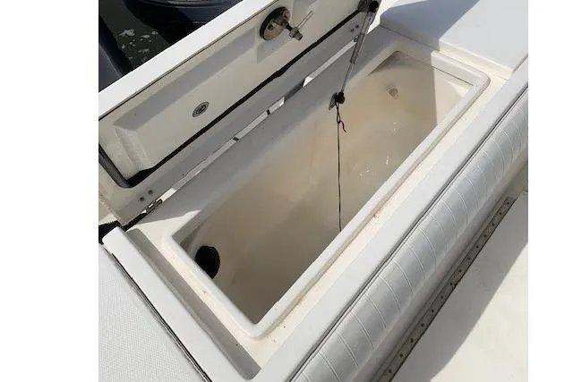 Slide: The Image of Open storage compartment on a 2006 Regulator 24 Classic boat. - 51
