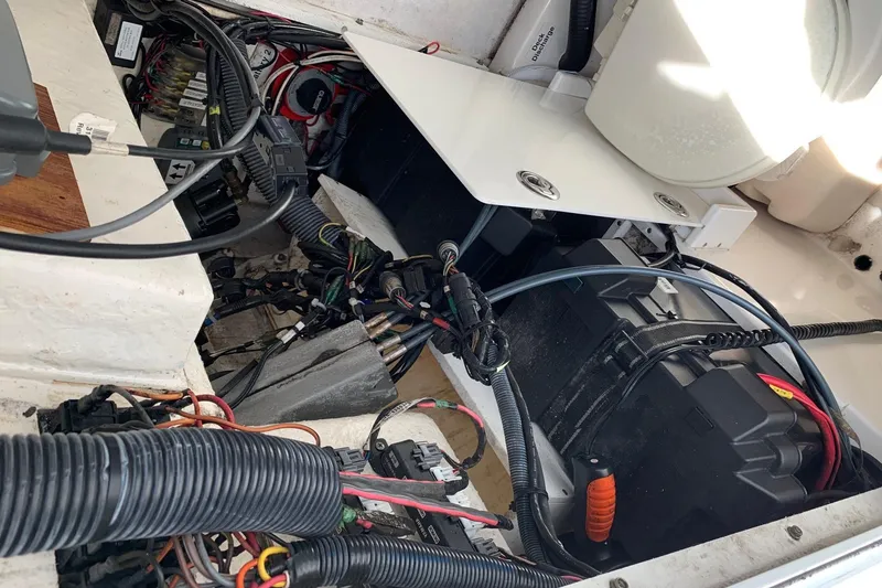 Slide: The Image of Electrical wiring and components inside a 2006 Regulator 24 Classic boat. - 59