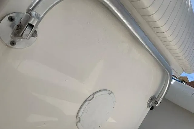 Slide: The Image of 2006 Regulator 24 Classic boat detail showing metal railing and white seating. - 67