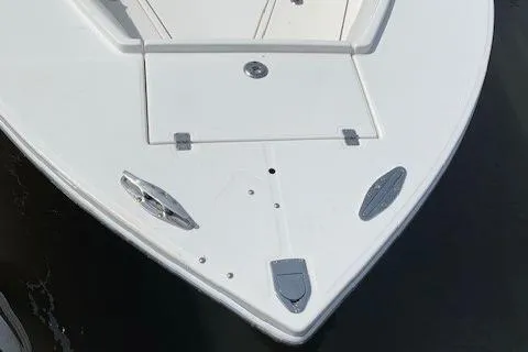 Slide: The Image of 2006 Regulator 24 Classic boat bow, featuring sleek design and stainless steel fixtures. - 69