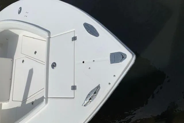 Slide: The Image of 2006 Regulator 24 Classic boat deck with storage compartments and sleek design. - 70