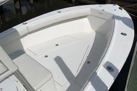 Slide: The Image of 2006 Regulator 24 Classic boat deck, featuring spacious seating and storage compartments. - 9