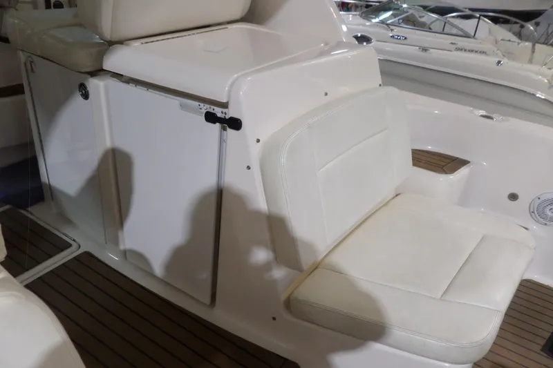Slide: The Image of 2006 Tiara Yachts 3600 Sovran interior with white seating and wooden flooring. - 12